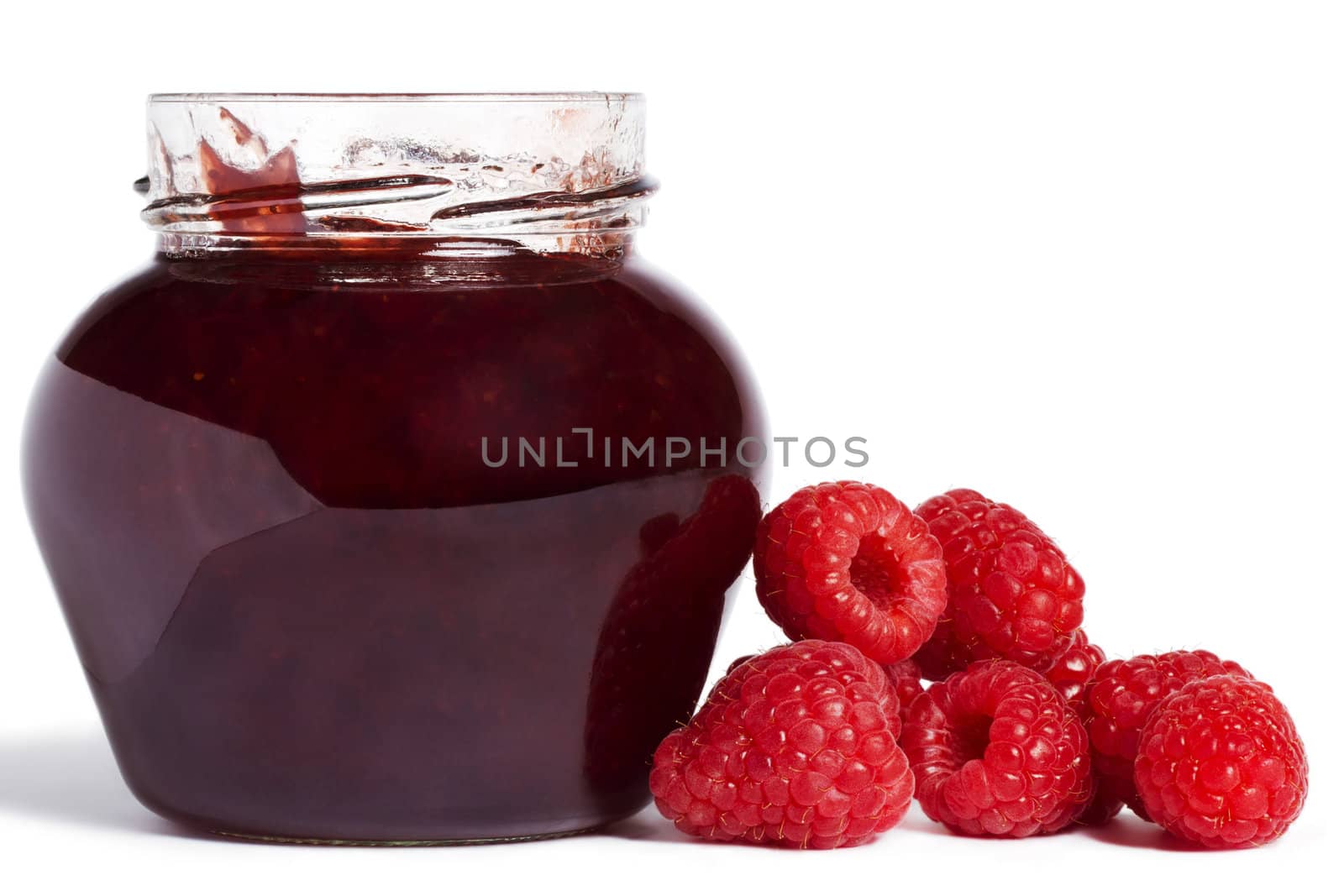  raspberry jam jar with raspberries aside on white background