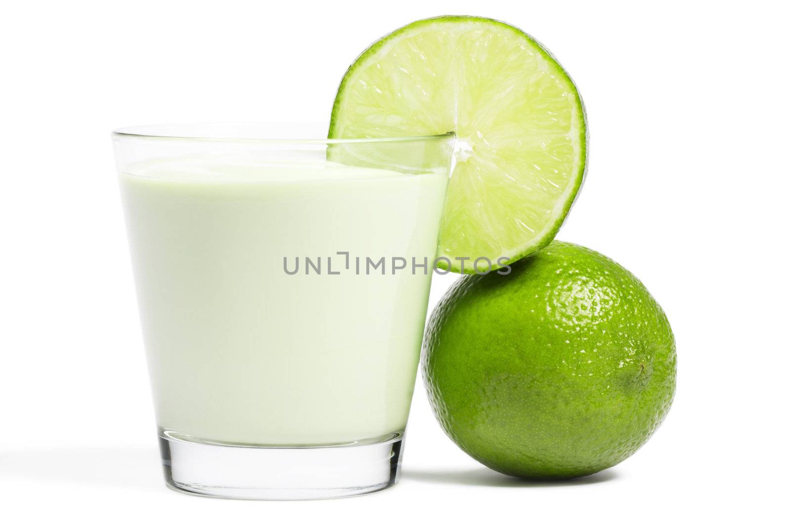 lime blade on a milkshake and lime aside on white background
