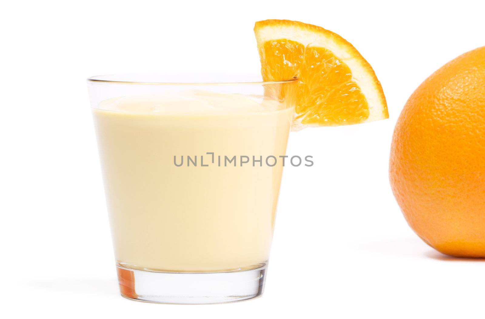 milkshake with a piece of orange and orange in back on white background