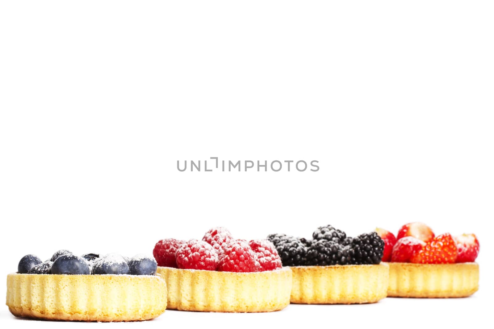 sugar coveres blueberries in front of wild berries in tartlets by RobStark