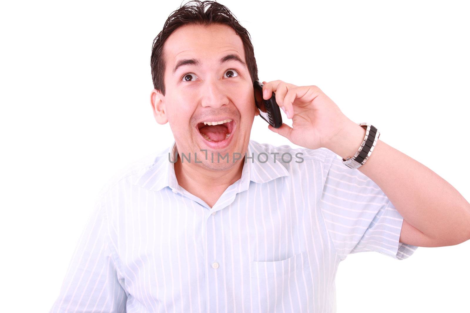 beautiful young man laughs and talks by mobile phone