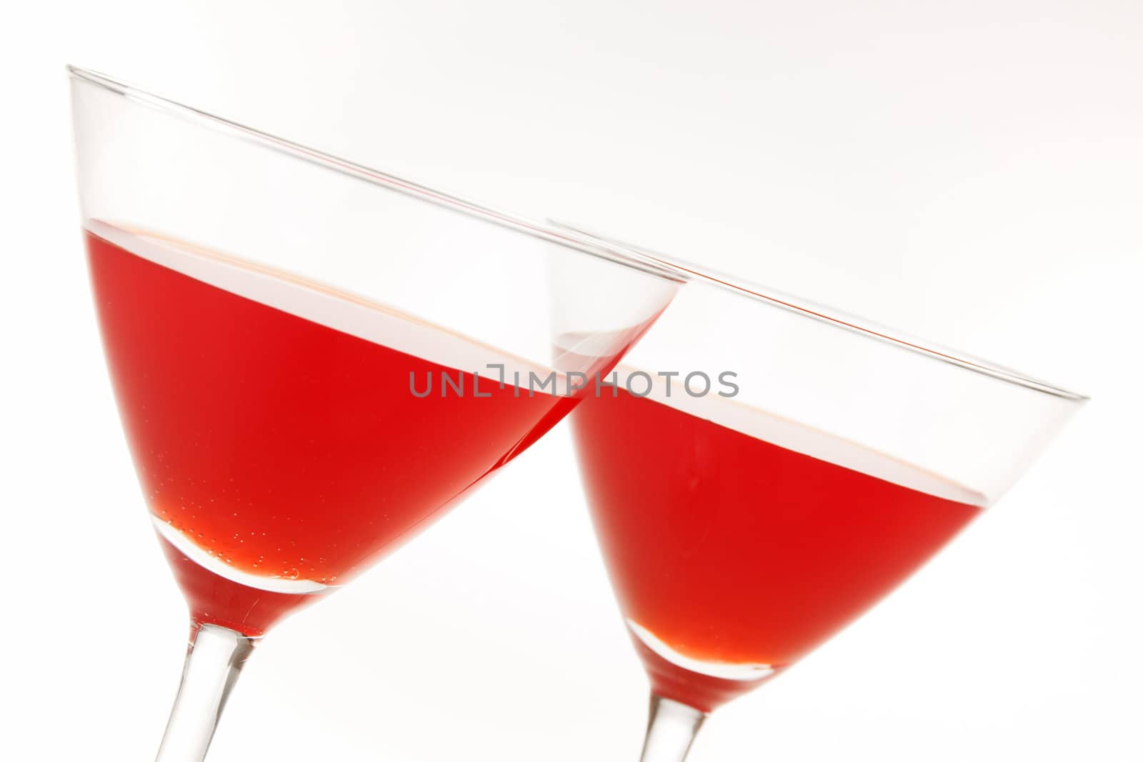 Close-up of two cocktail glasses with red liquid inside