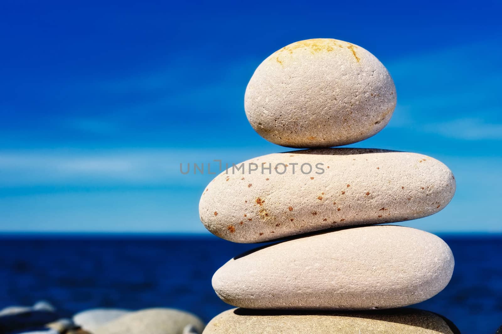 Massive boulders one on another, against the sky