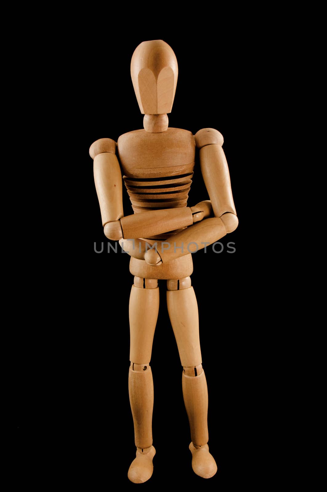 A wooden armature crosses his arms