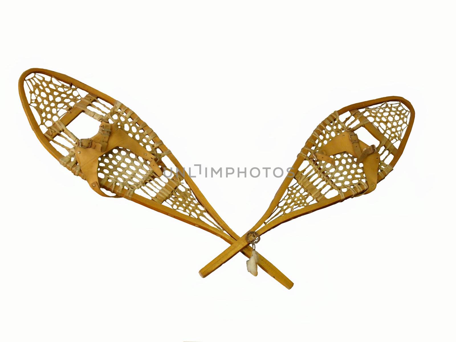 a pair of wooden snow shoes isolated on white