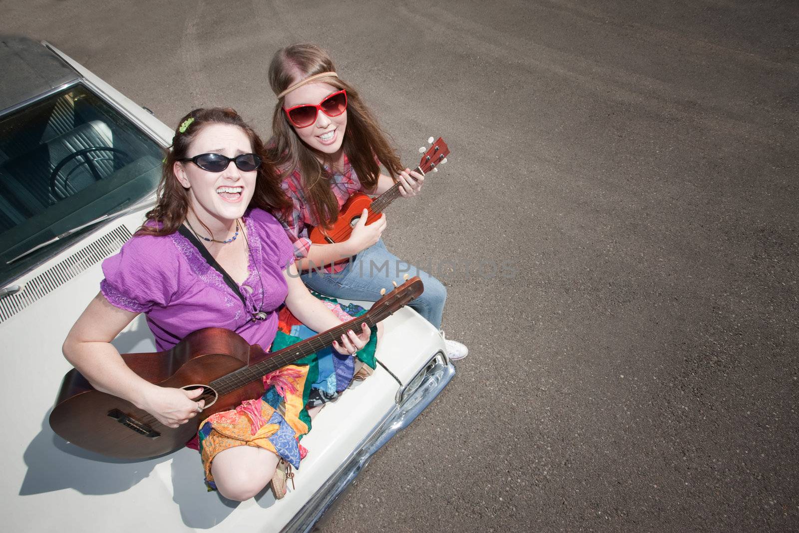 Female Musicians on an Old Car