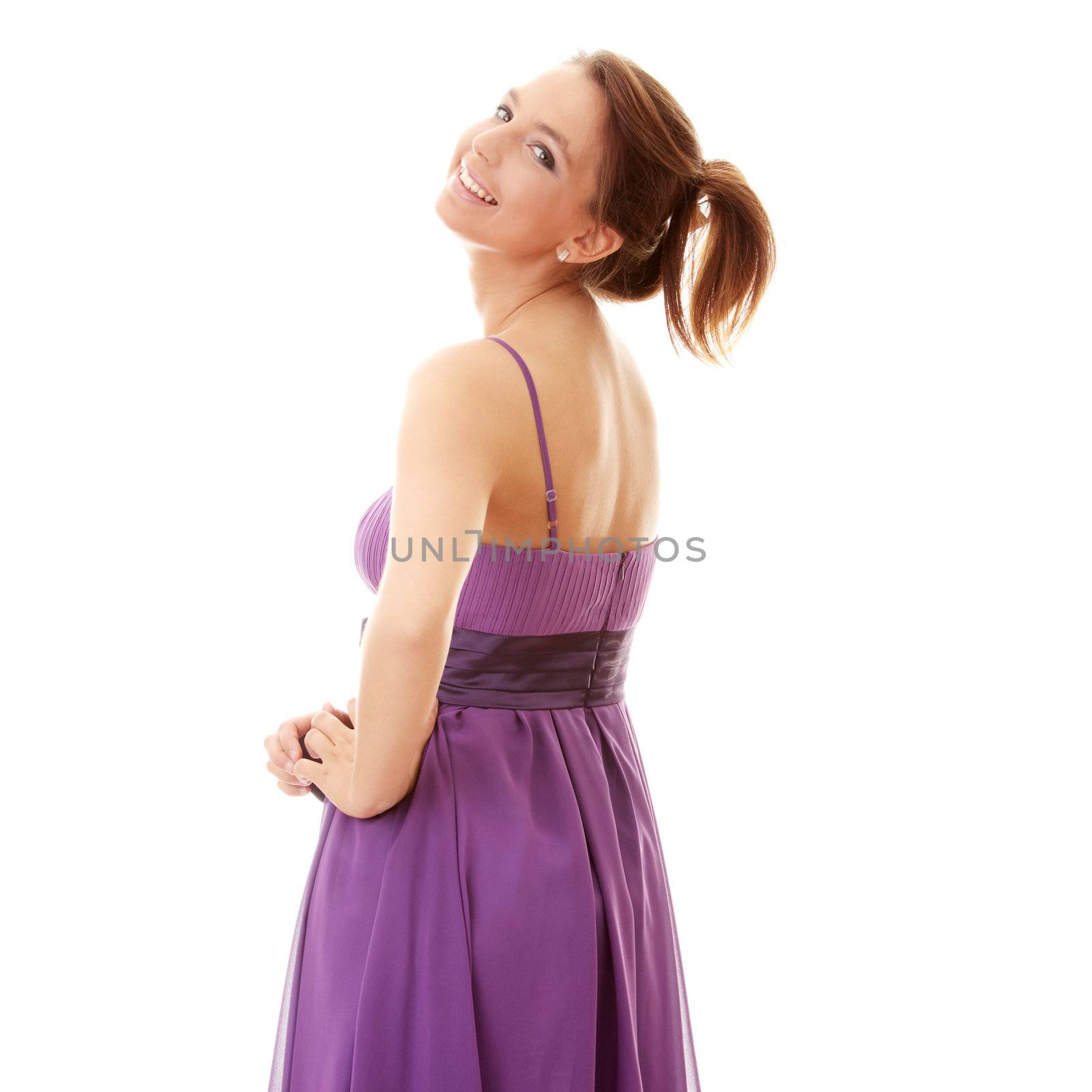 Attractive dancer girl in violet classic dress, studio shot