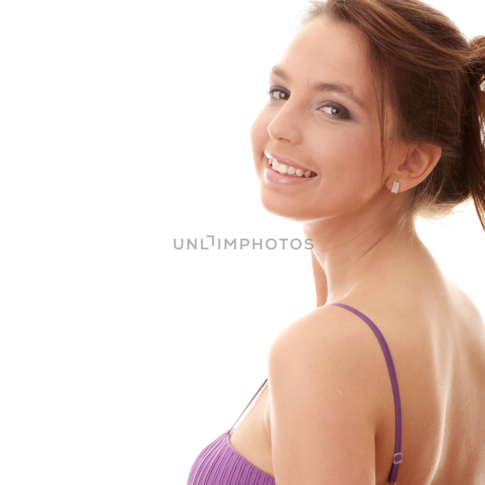 Attractive dancer girl in violet classic dress, studio shot