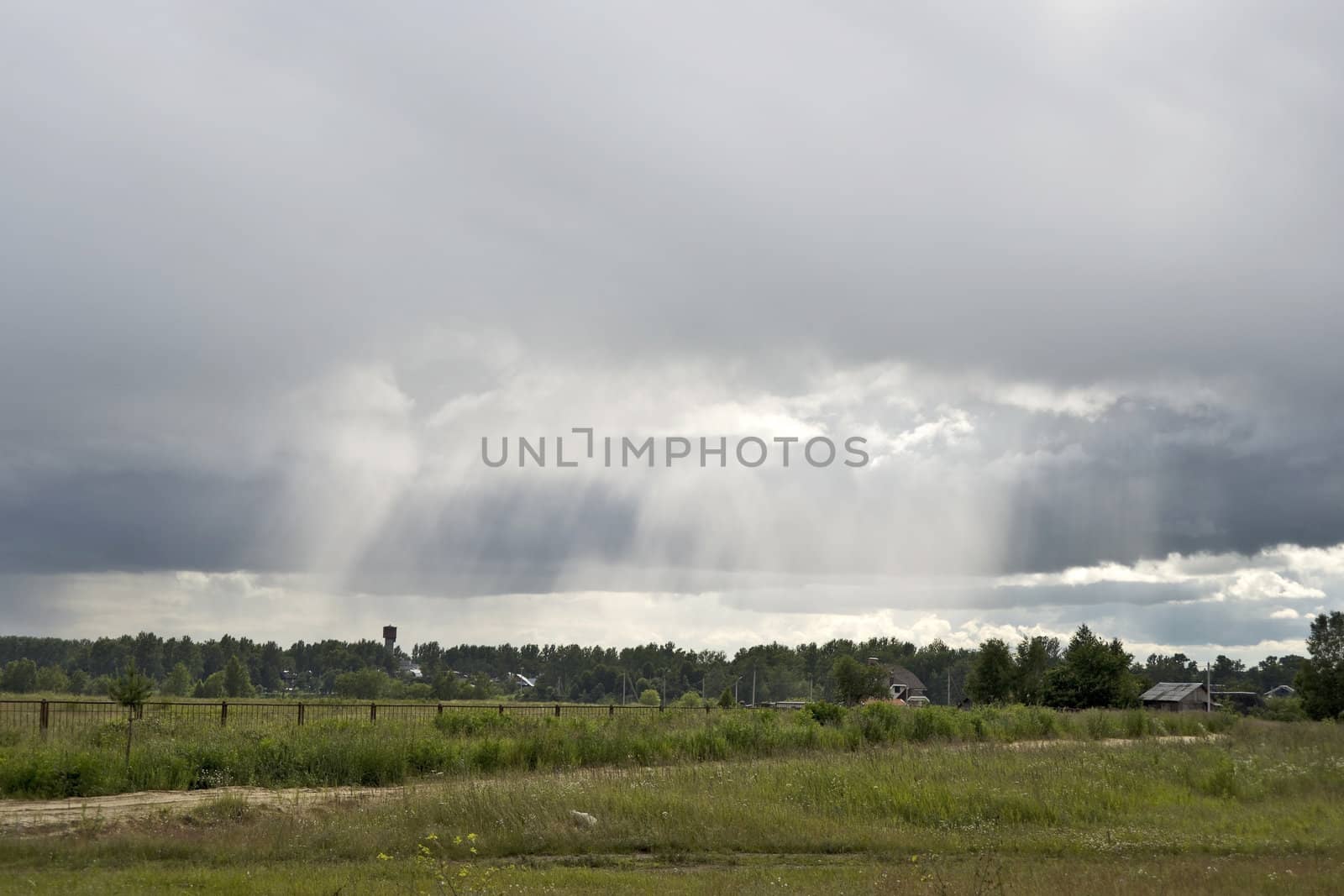 Sunlight runs cumulonimbus and light on country houses