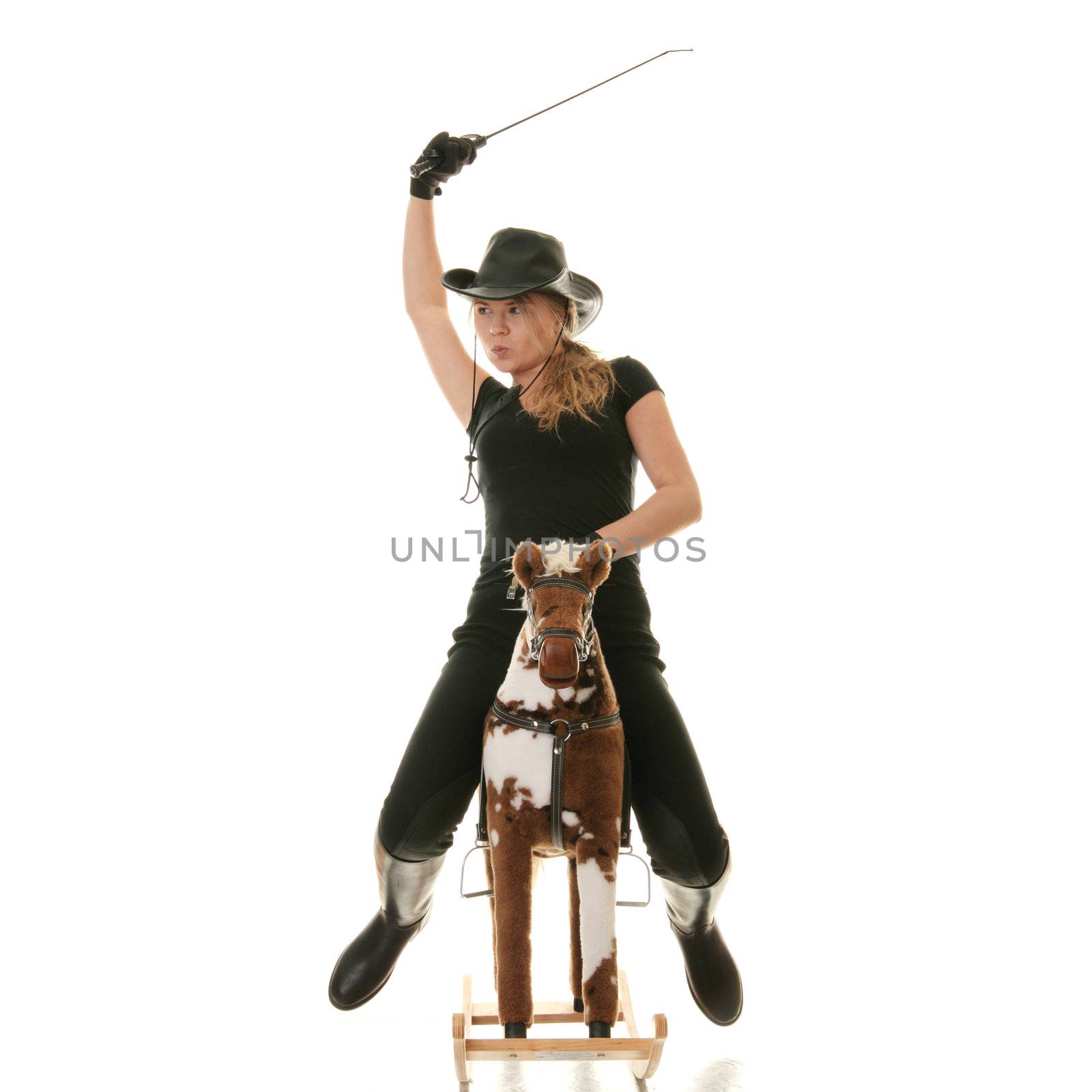 Young beautiful cowgirl (jockey) race on hobbyhorse with face expression isolated on white background (race concept).