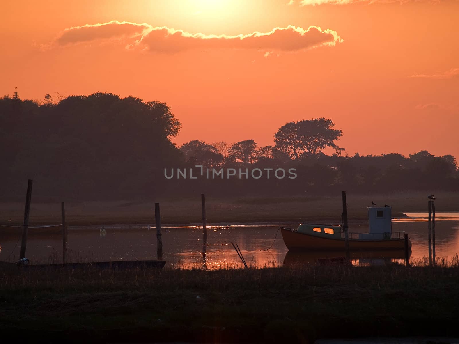 Boat in an amazing seascape of magical sunset - perfect nature boating background