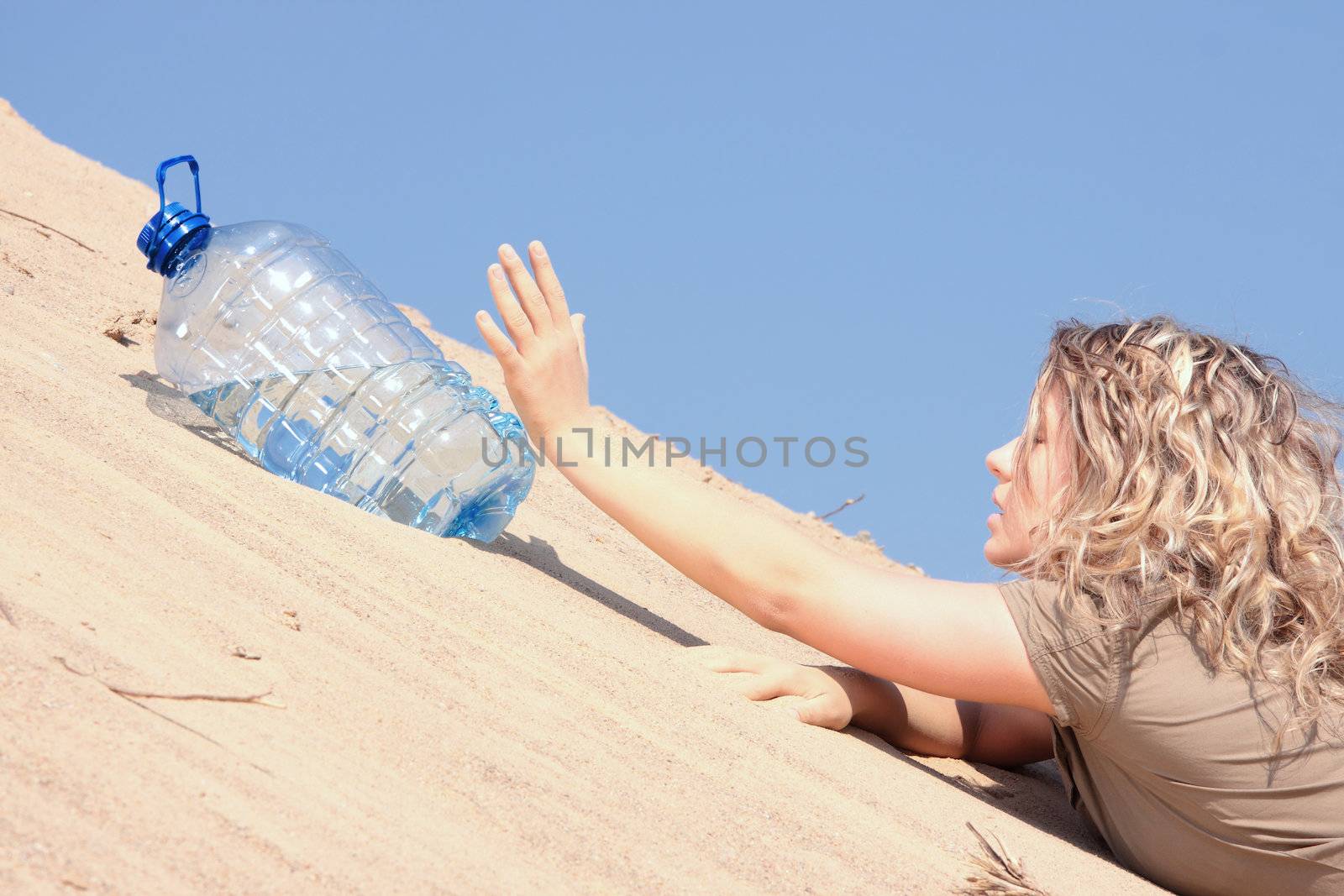 Thirsty girl looking for water on desert