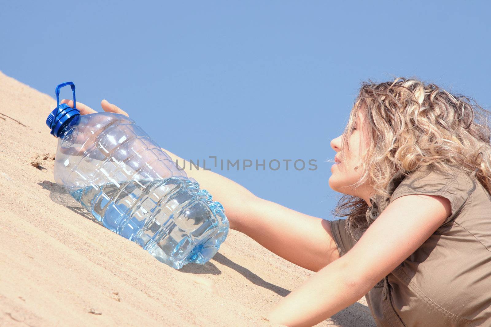 Thirsty girl looking for water on desert