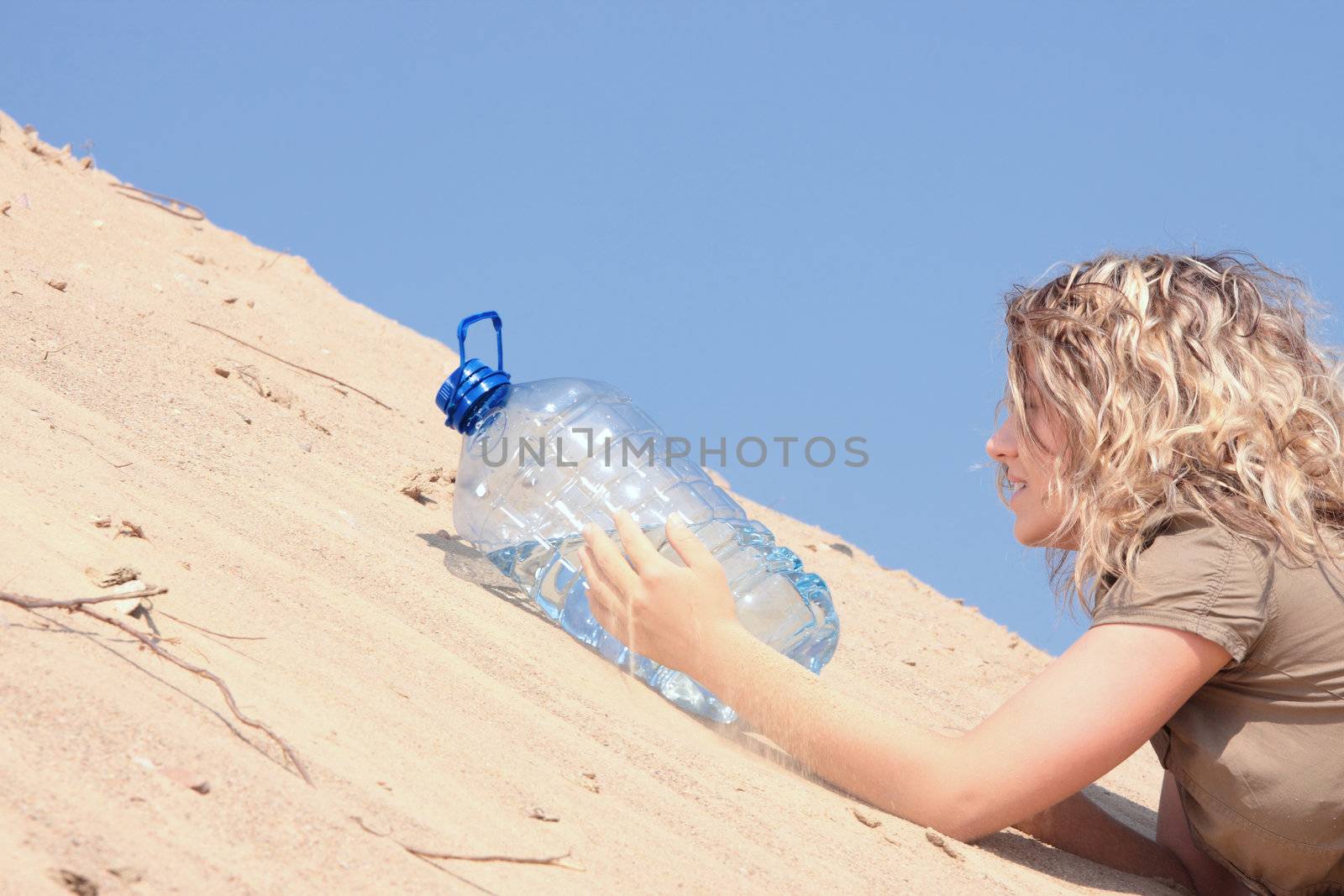 Thirsty girl looking for water on desert