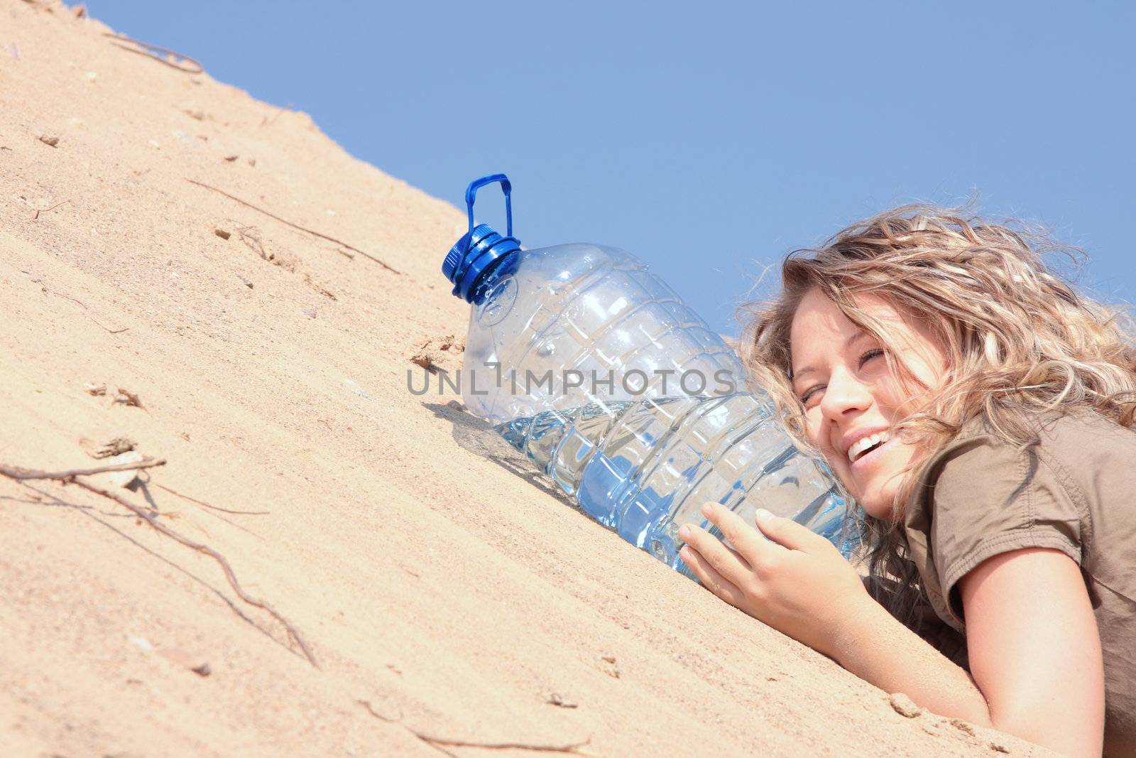 Thirsty girl looking for water on desert