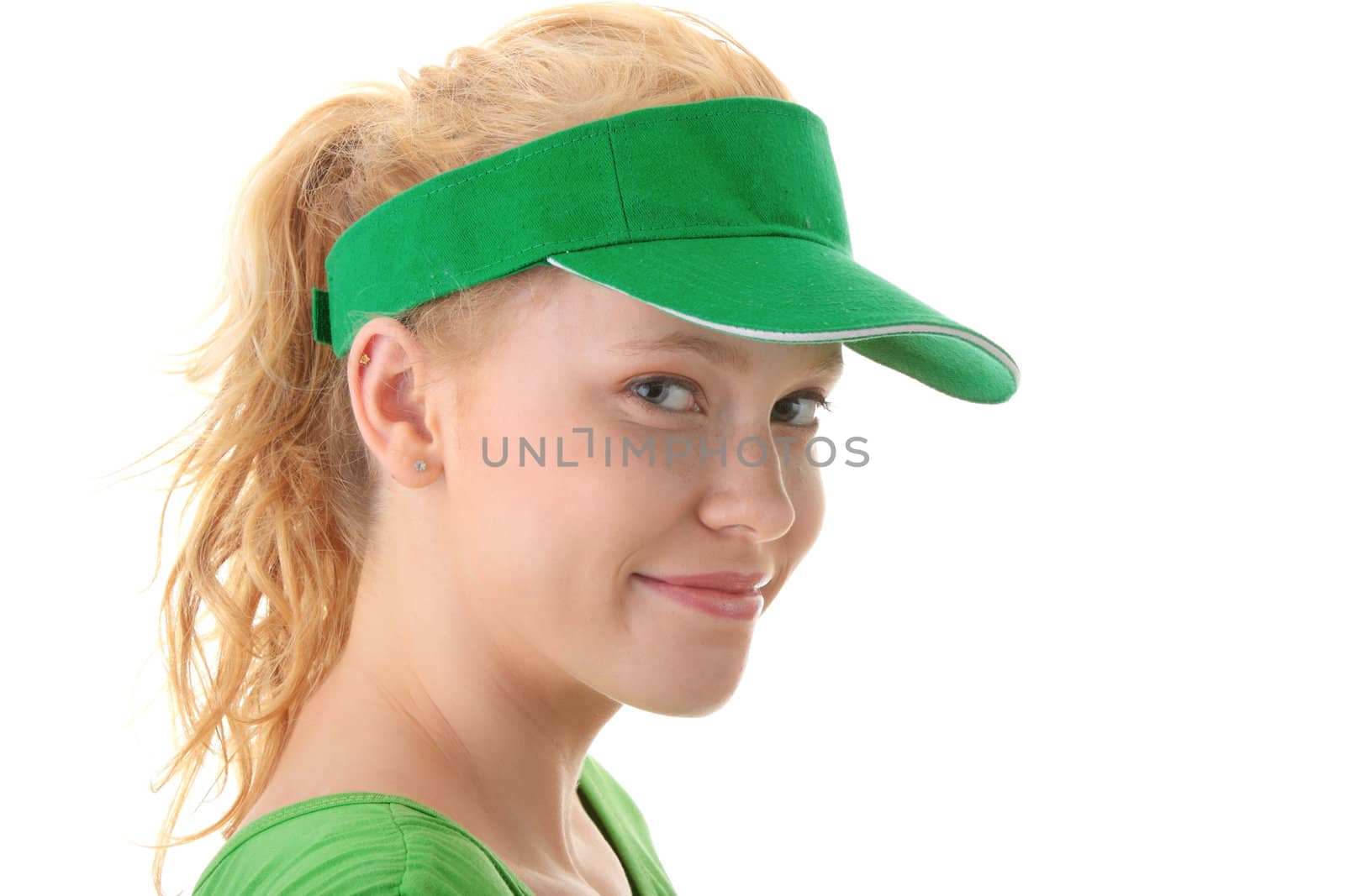 Young beautiful blond woman with green cap isolated on white background