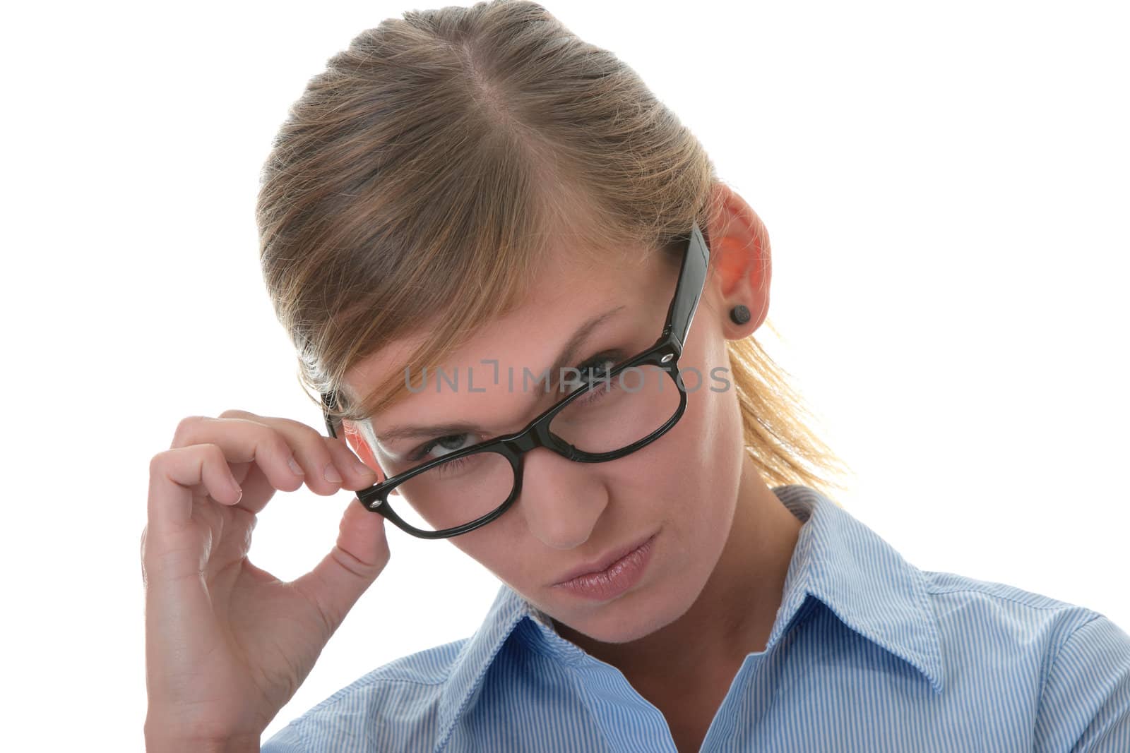 Portrait of a thoughtful young woman in blue shirt and glasses (student, secretary or businesswoman)