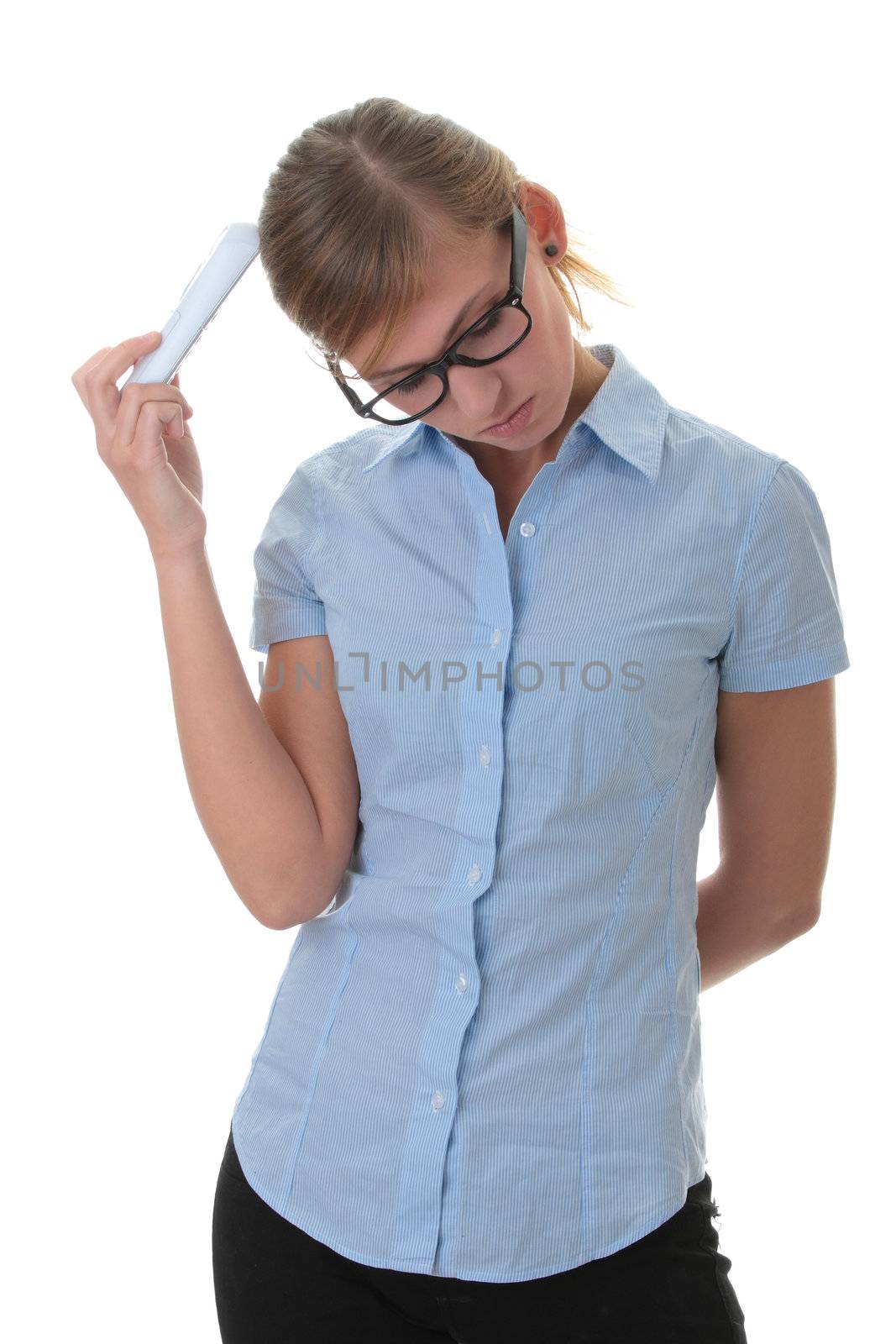 Portrait of a thoughtful young woman in blue shirt and glasses with phone