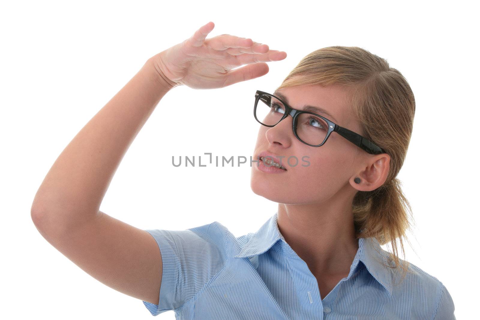 Portrait of a thoughtful young woman in blue shirt and glases (student, secretary or buisnesswoman)