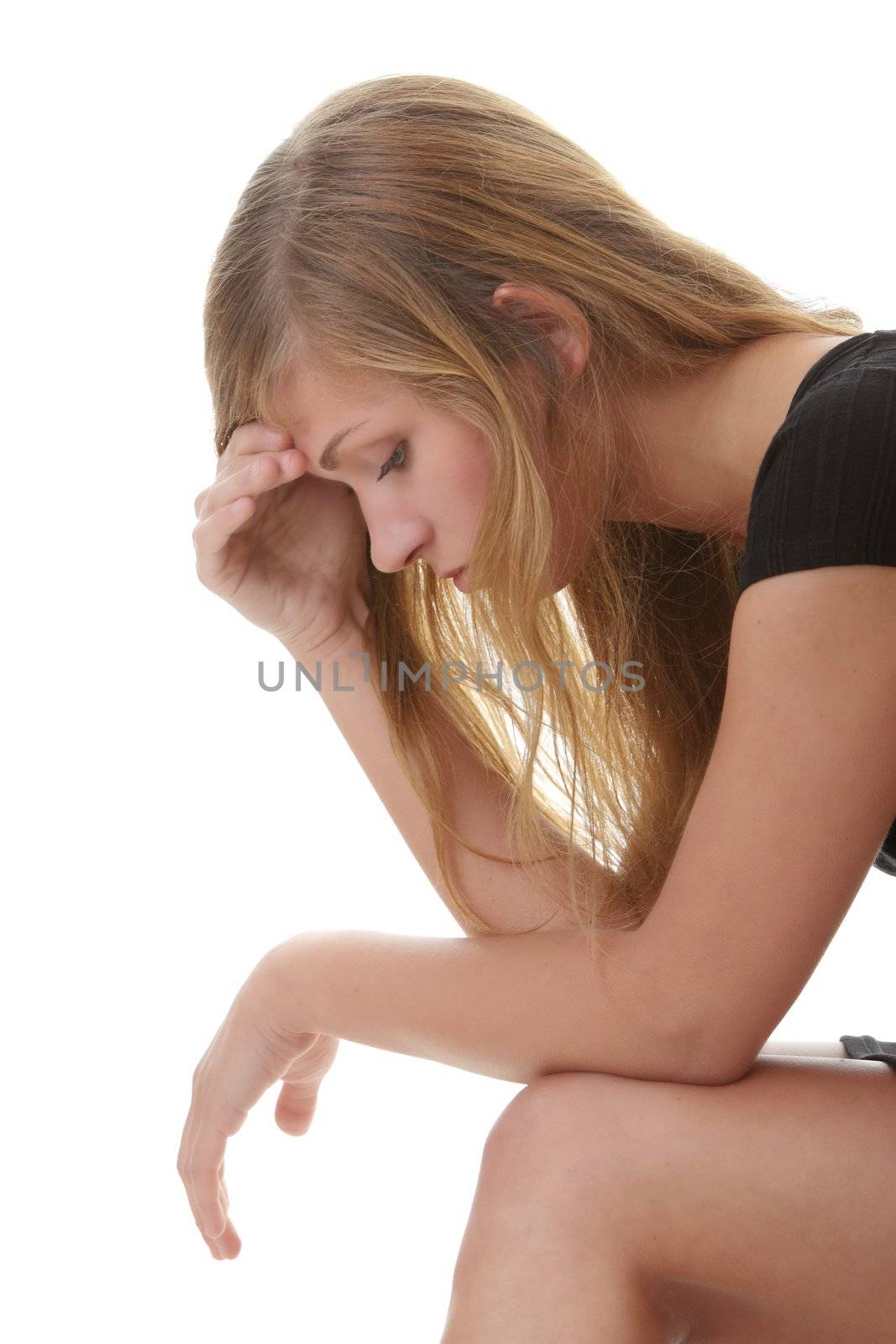 Beautiful young woman depressed - isolated on white background