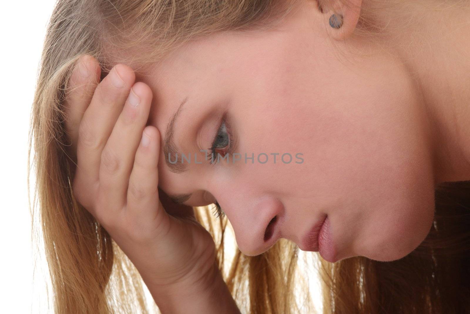 Beautiful young woman depressed - isolated on white background