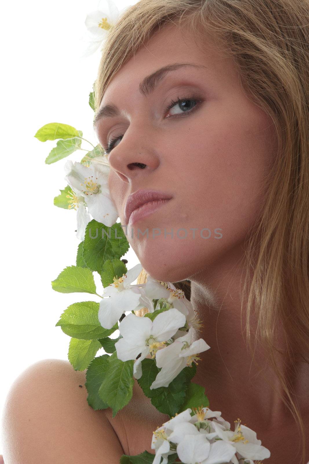 Beautiful blond woman with small white apple tree flowers by BDS