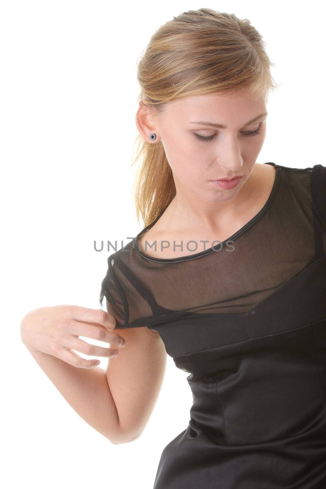 Pretty woman with slim waist pose on white background dressed in style black dress