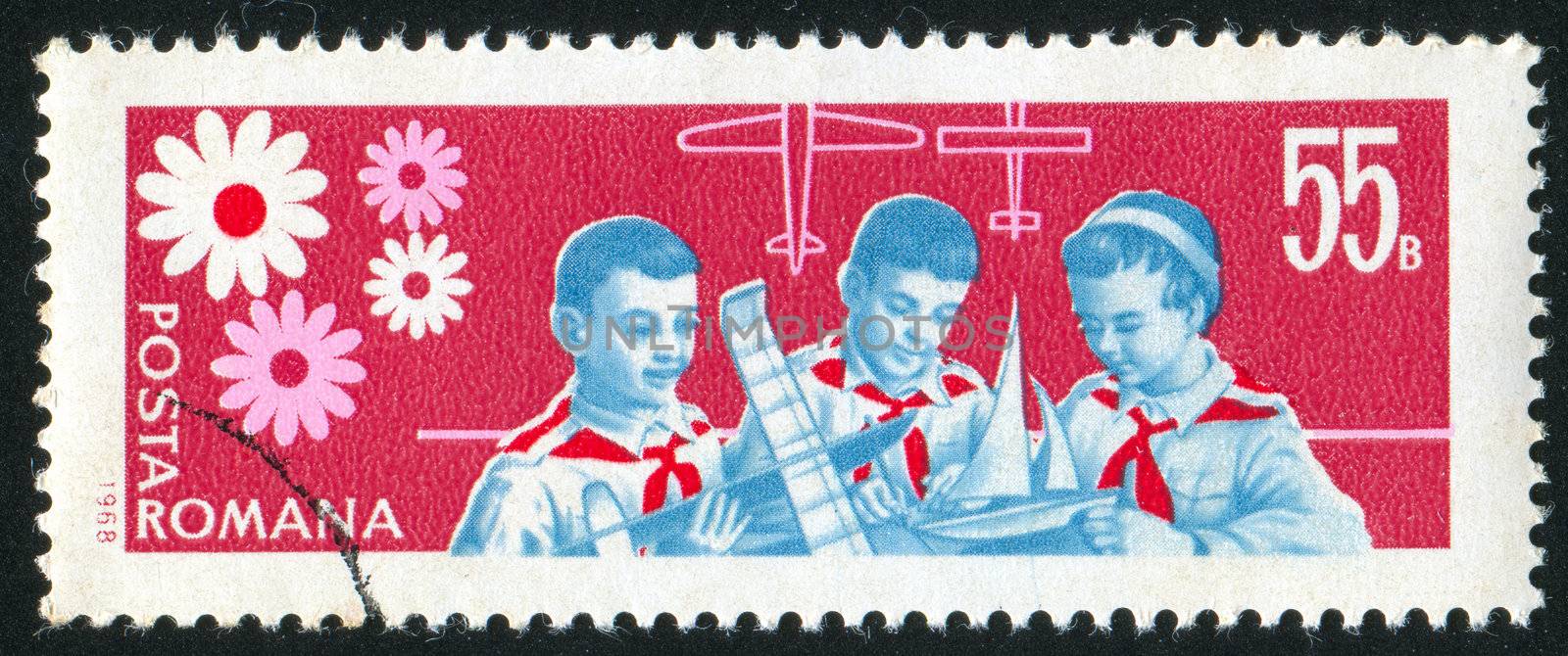 ROMANIA - CIRCA 1968: stamp printed by Romania, shows pioneer building model of plane and boat, circa 1968