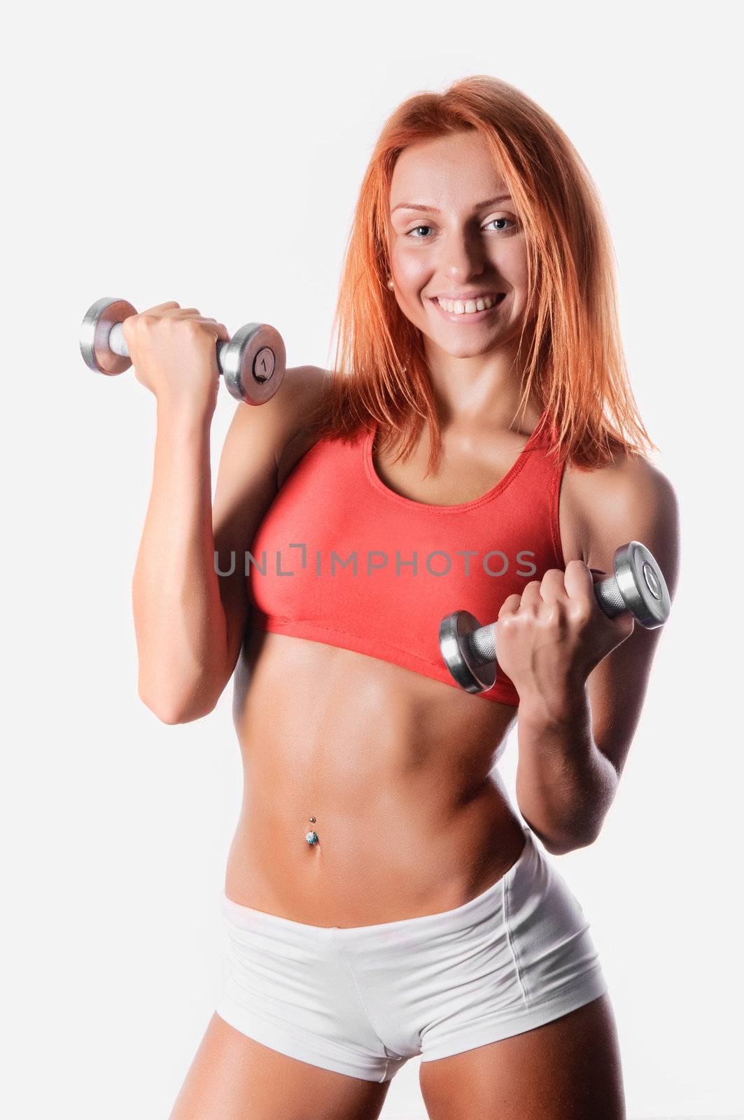 The young coach is engaged in bodybuilding dumbbell
