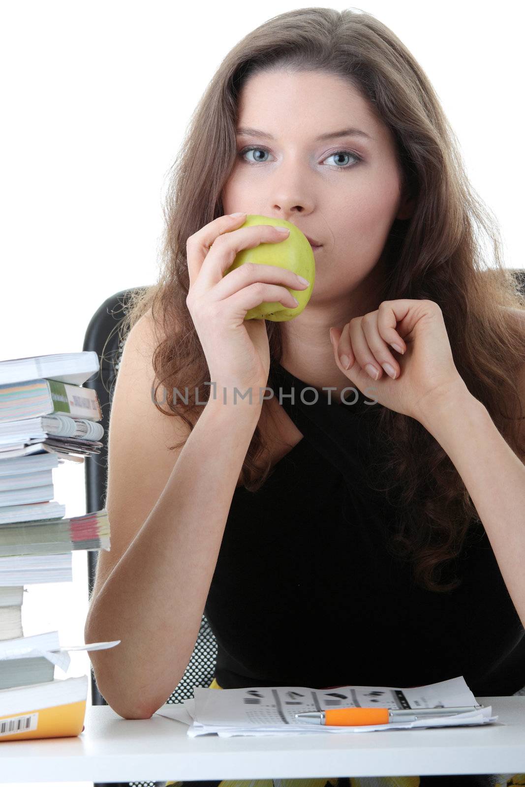 Portrait of young and pretty female student with books around isolated on white background