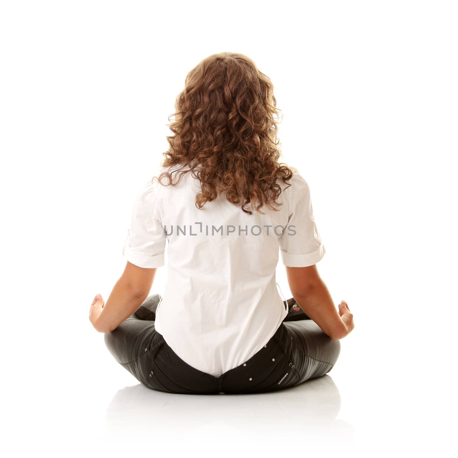 Businesswomen meditating in lotus position isolated on white