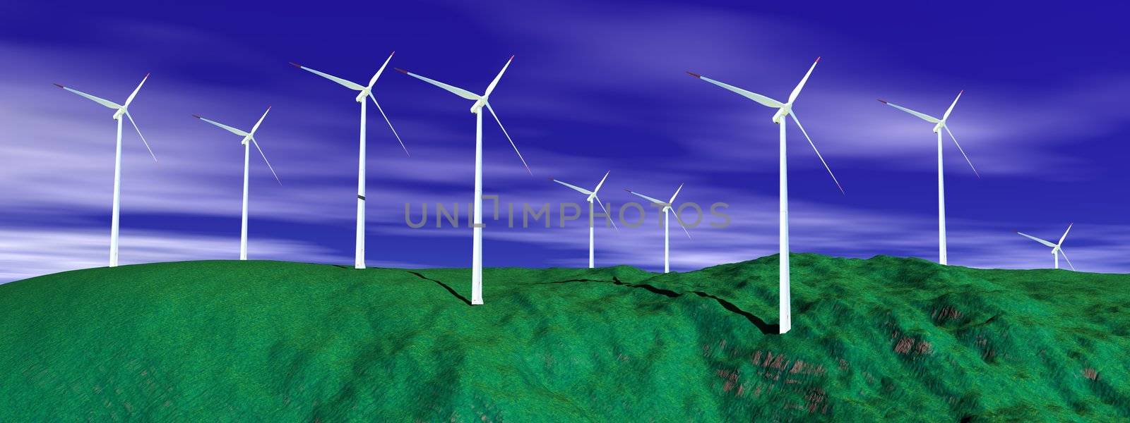 Wind turbines on a green hill with deep blue cloudy sky