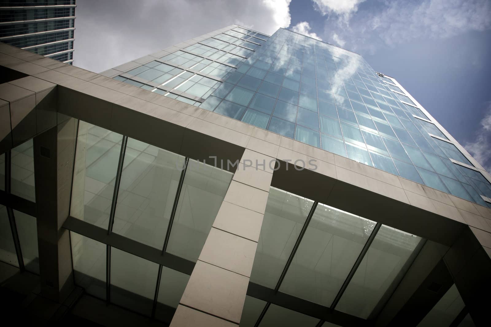 office building from outside with reflection of clouds