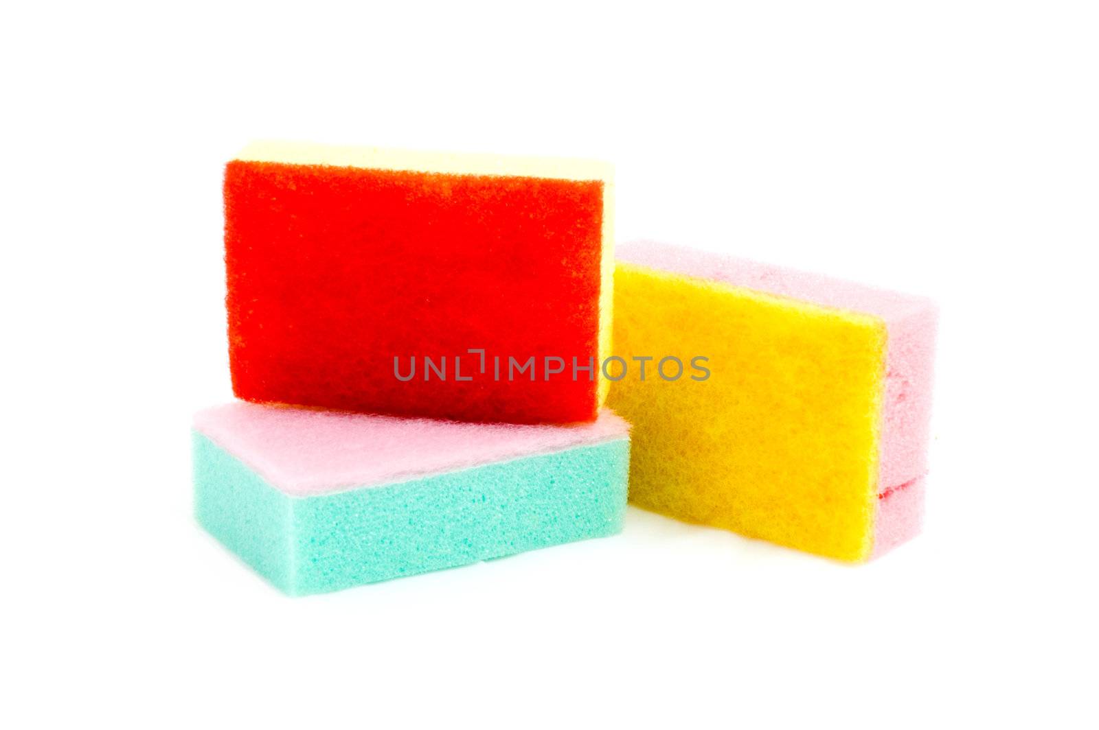 stack of colorful cleaning sponges isolated on a white backgroun by ladyminnie