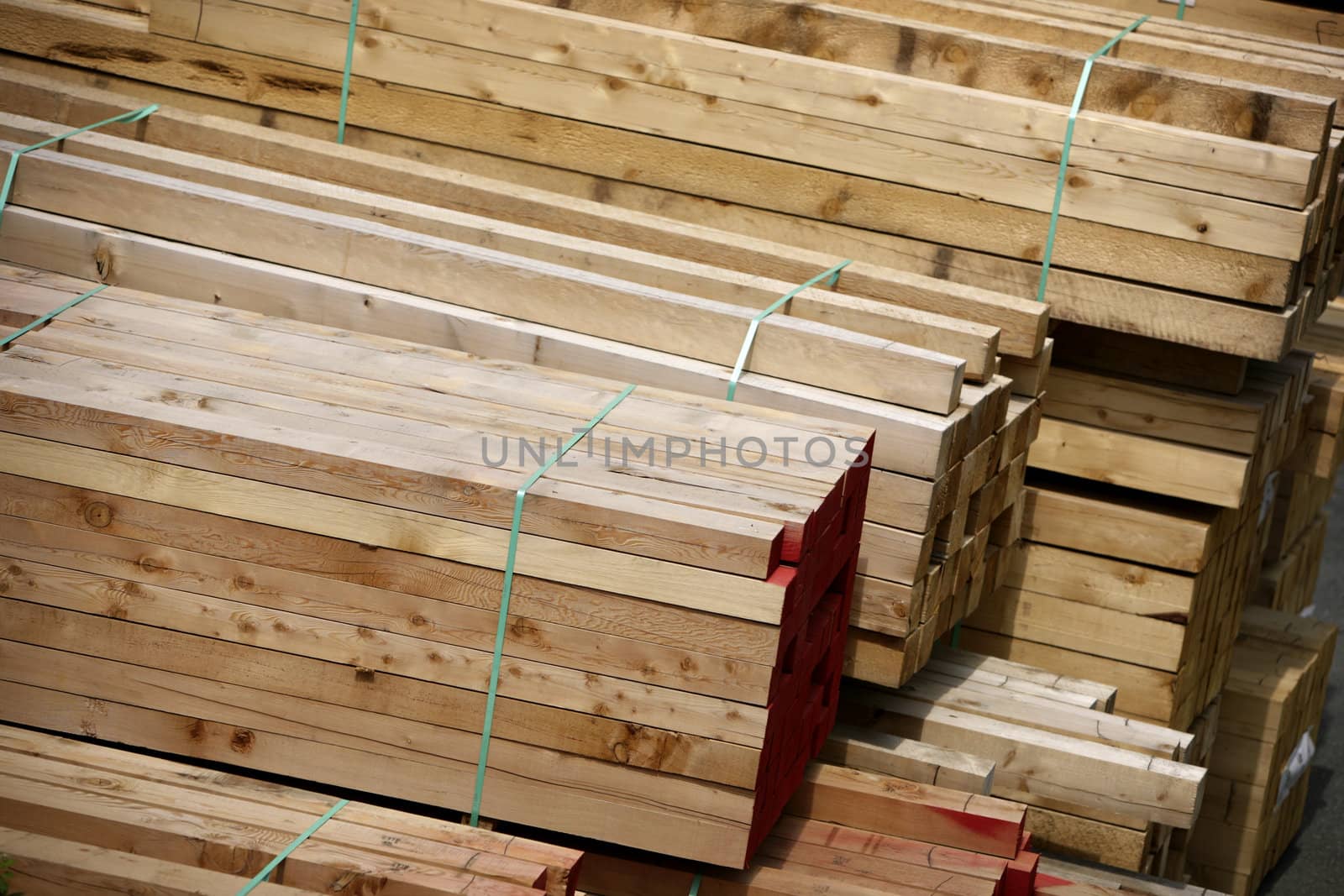 stacks of construction wood at a saw mill