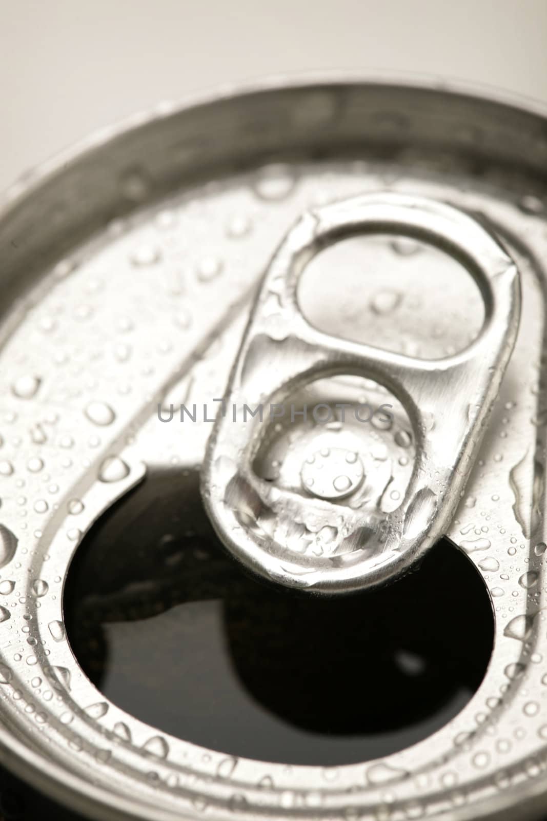 detail of an open beer can with water drops