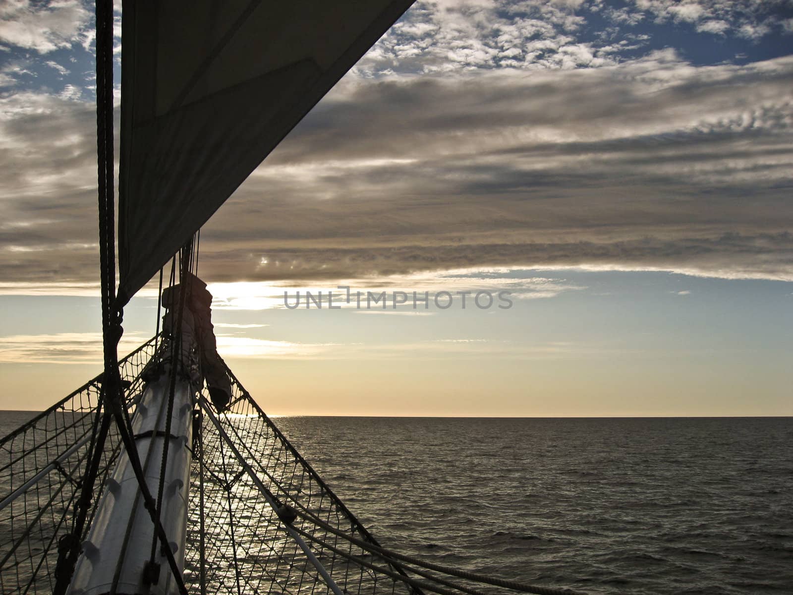 Sunset, ship on sea