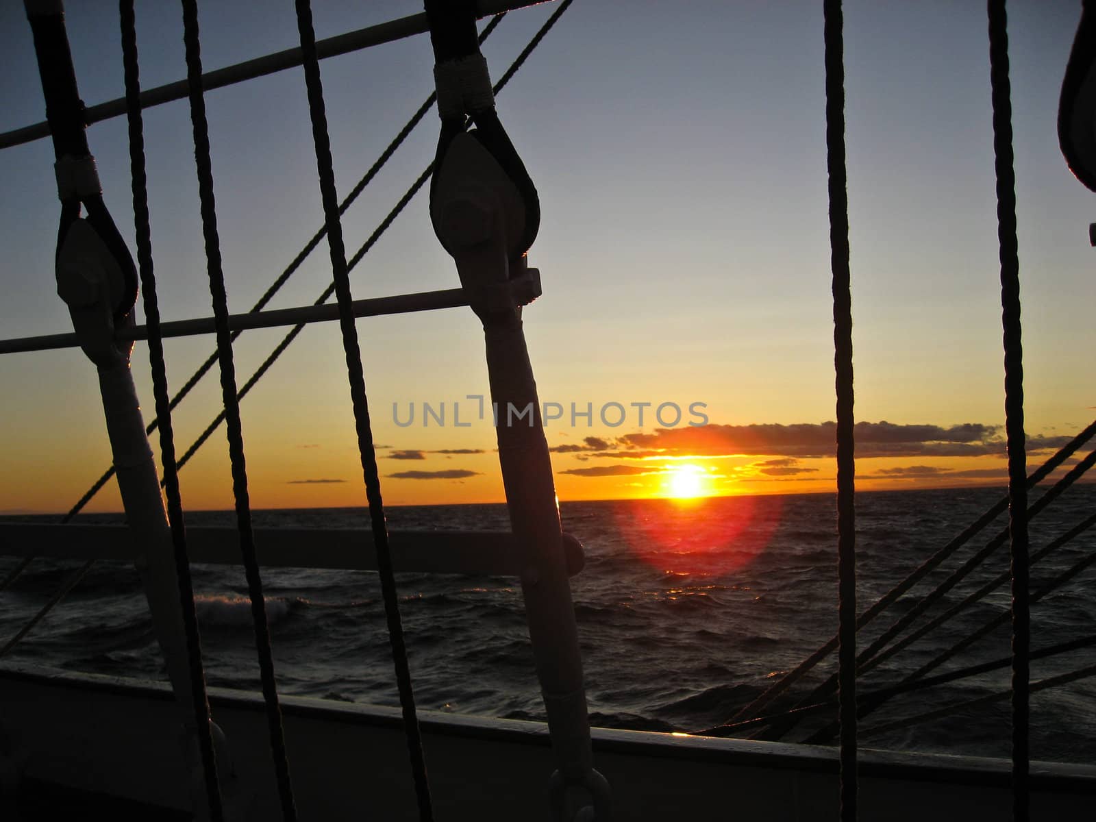 Sunset, ship on sea