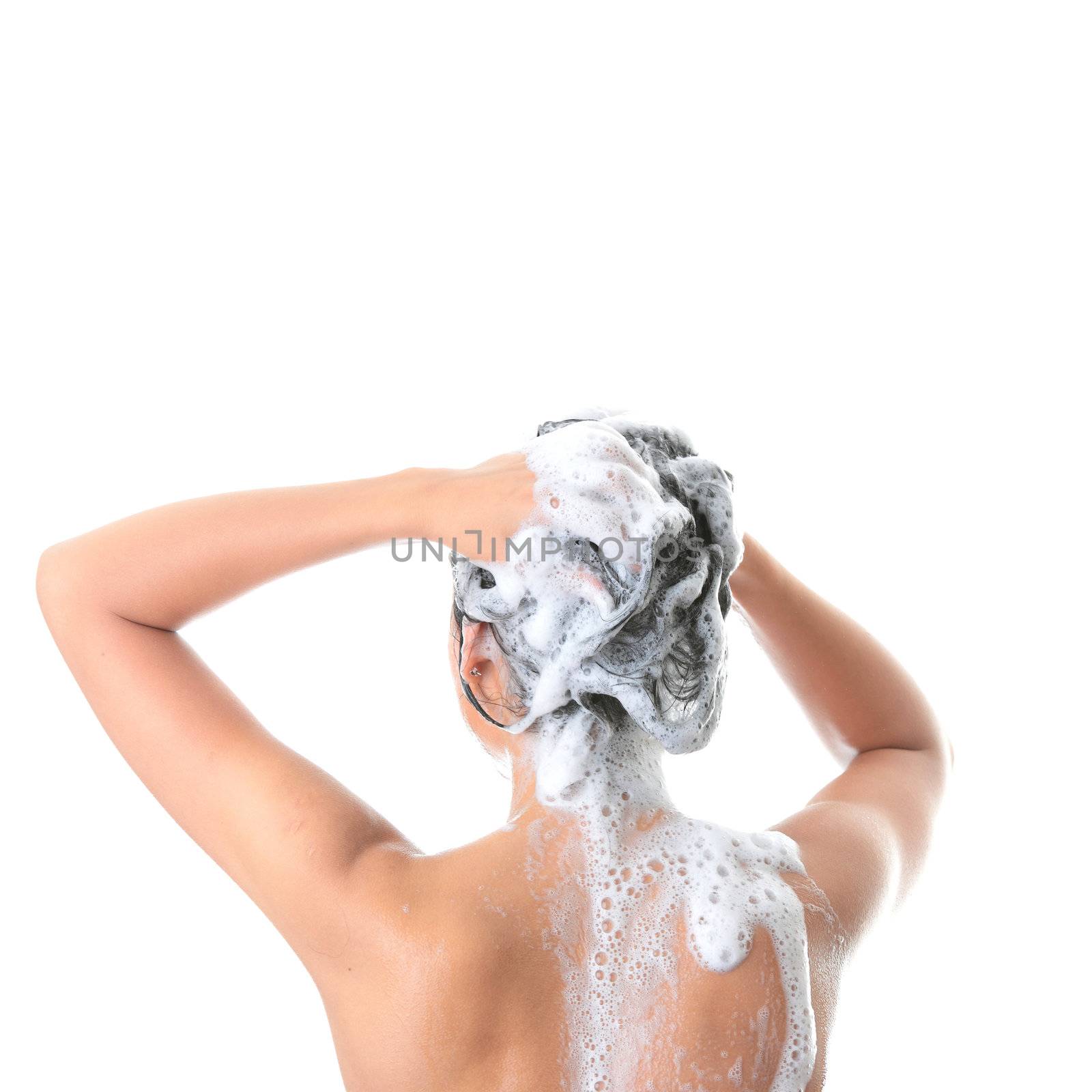 Young woman in shower washing her hairs isolated on white background