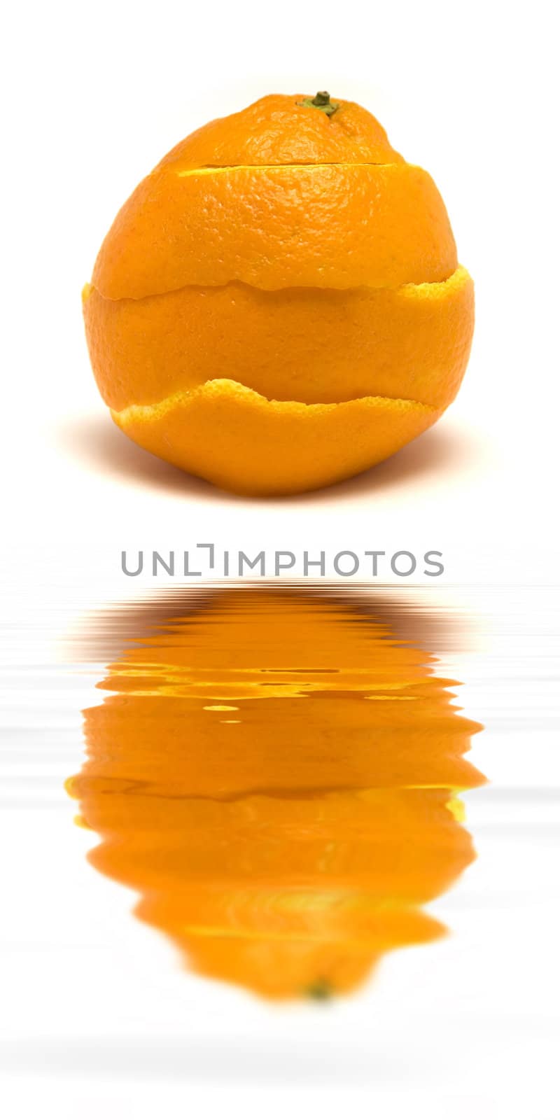 An orange peal being healed. 

(with water reflection)