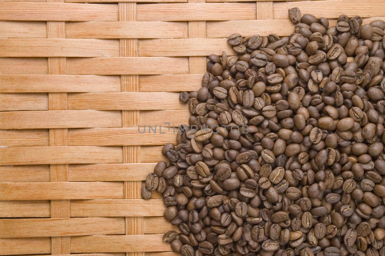 Coffee in grains on a background of a tree.