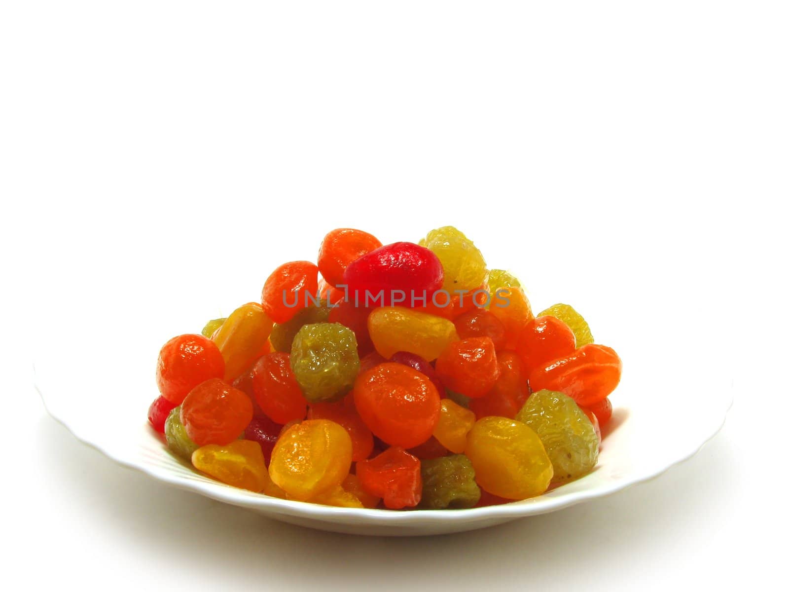 The candied fruits in a white plate