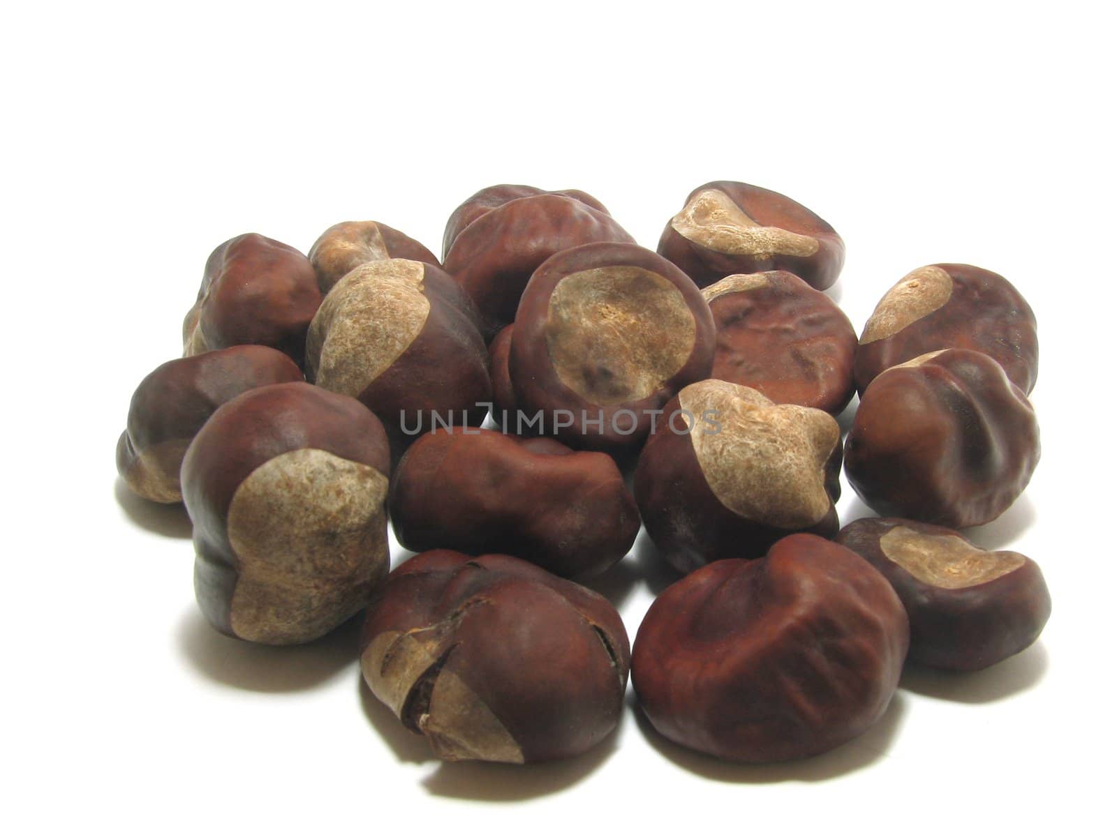 Handful of chestnuts on a white background