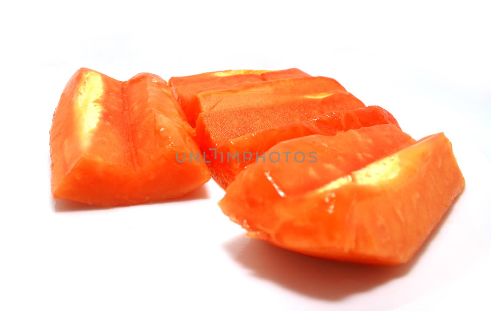 Cutted papaya fruits on white background with sharow.