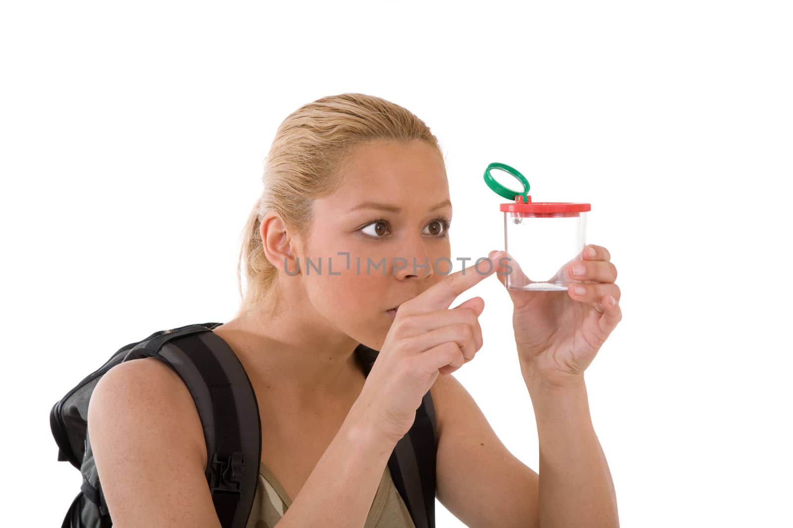 Pretty blond girl with a little examining box with a small spider 