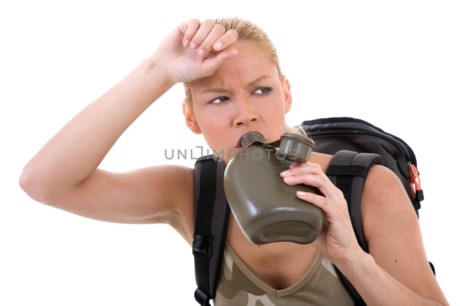 Pretty blond girl sitting and drinking water from her water bottle