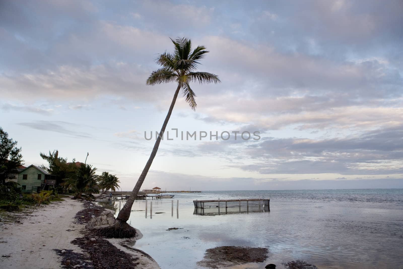 A small fishpen in the shallows close to a beautiful beach in the Gulf of Mexico at sunset.