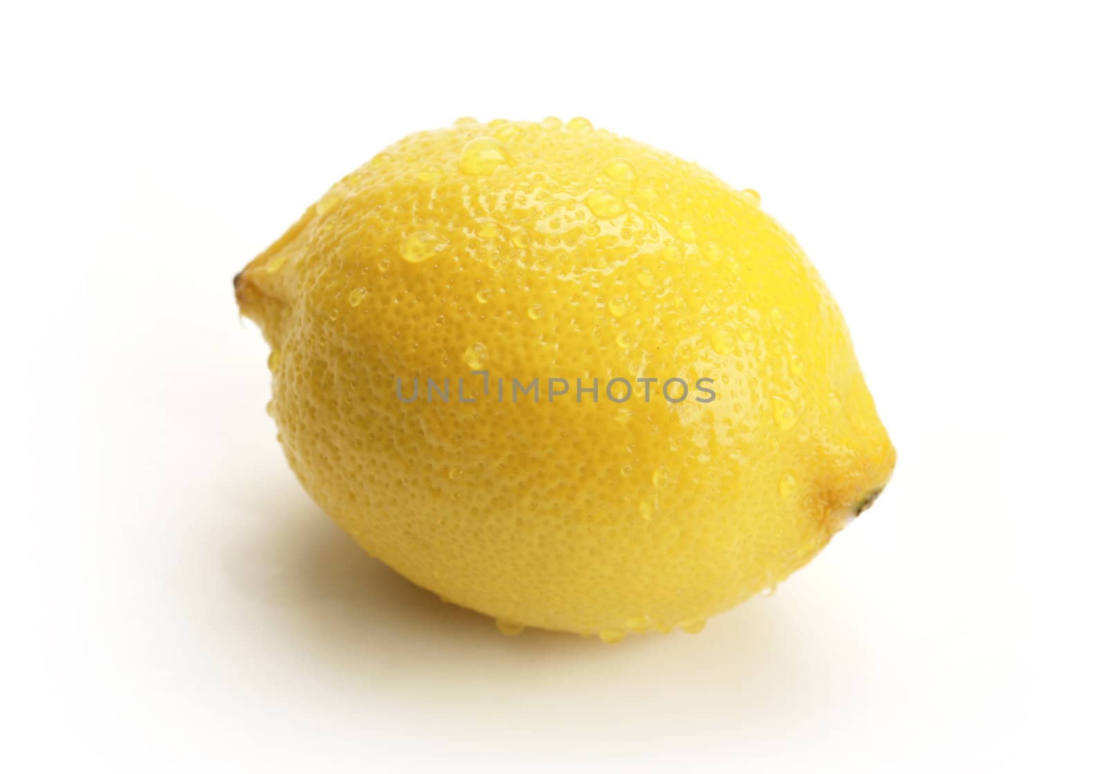 fresh lemon with water drops on white background