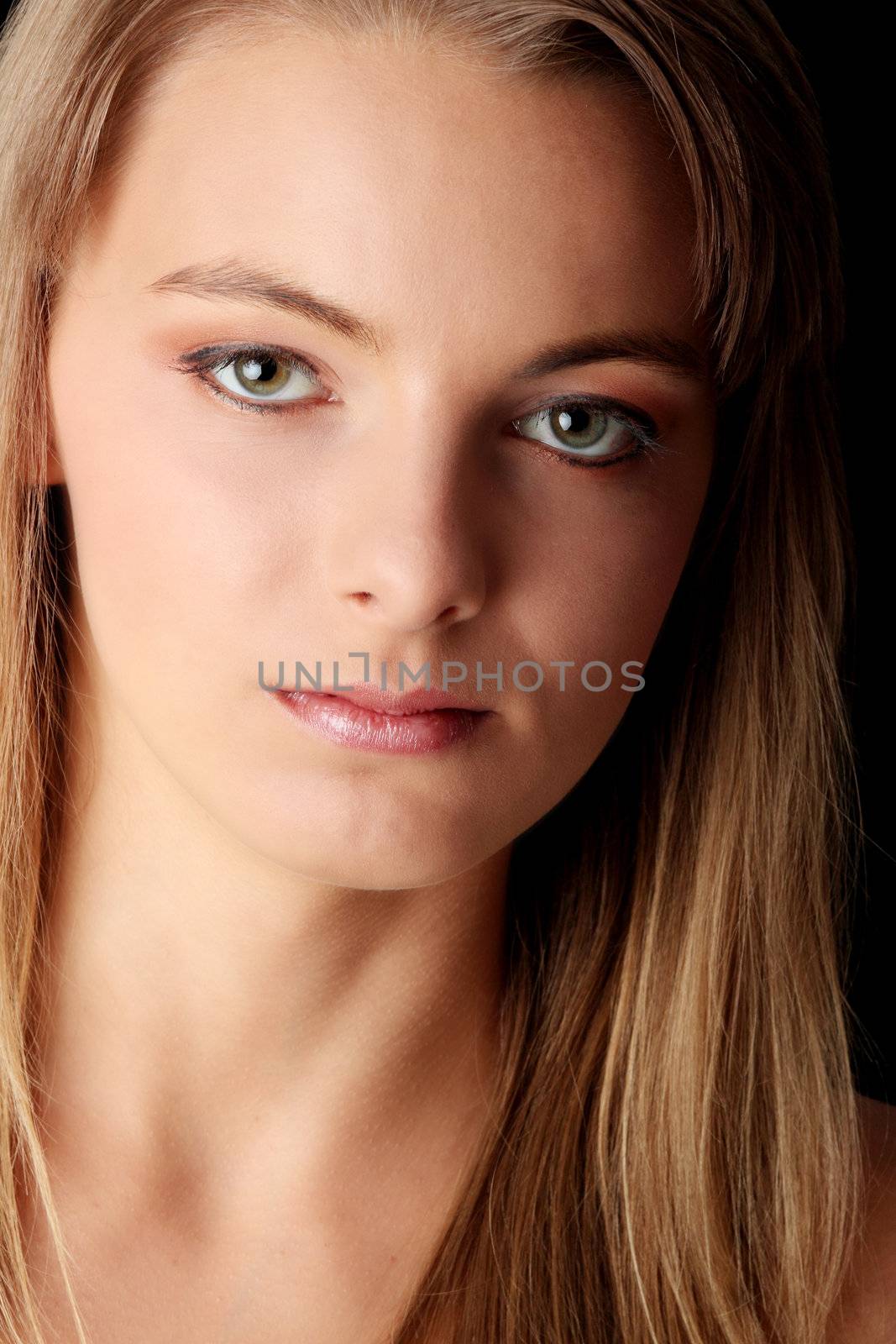 Young beautiful woman portrait isolated on black background