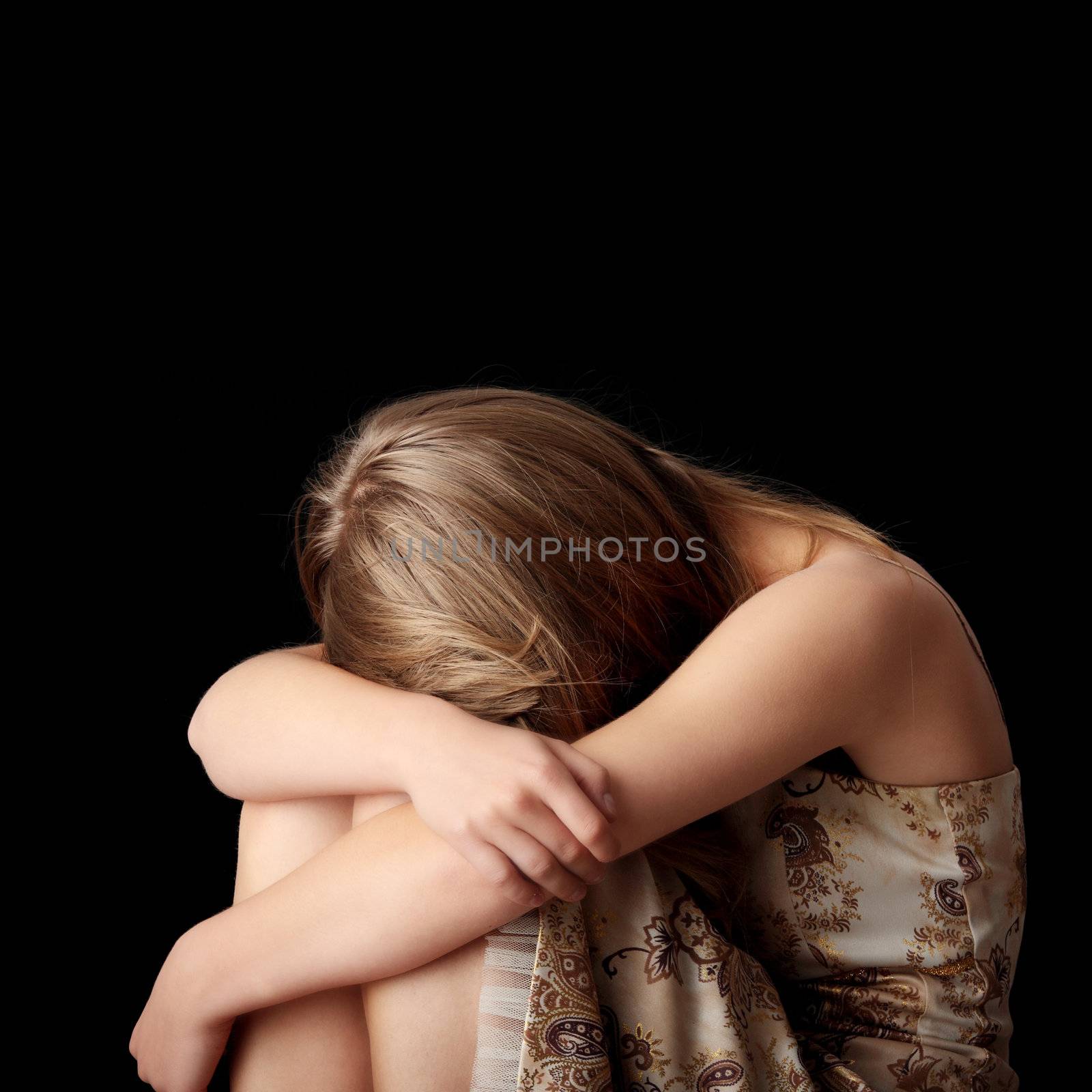 Young woman depression isolated on black background